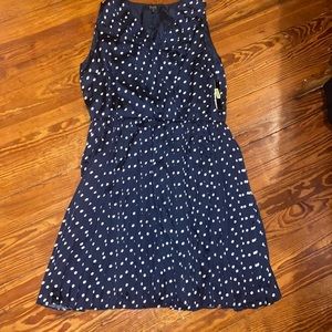 1X Navy blue with white polkadots sleeveless dress the lower half is pleated.
